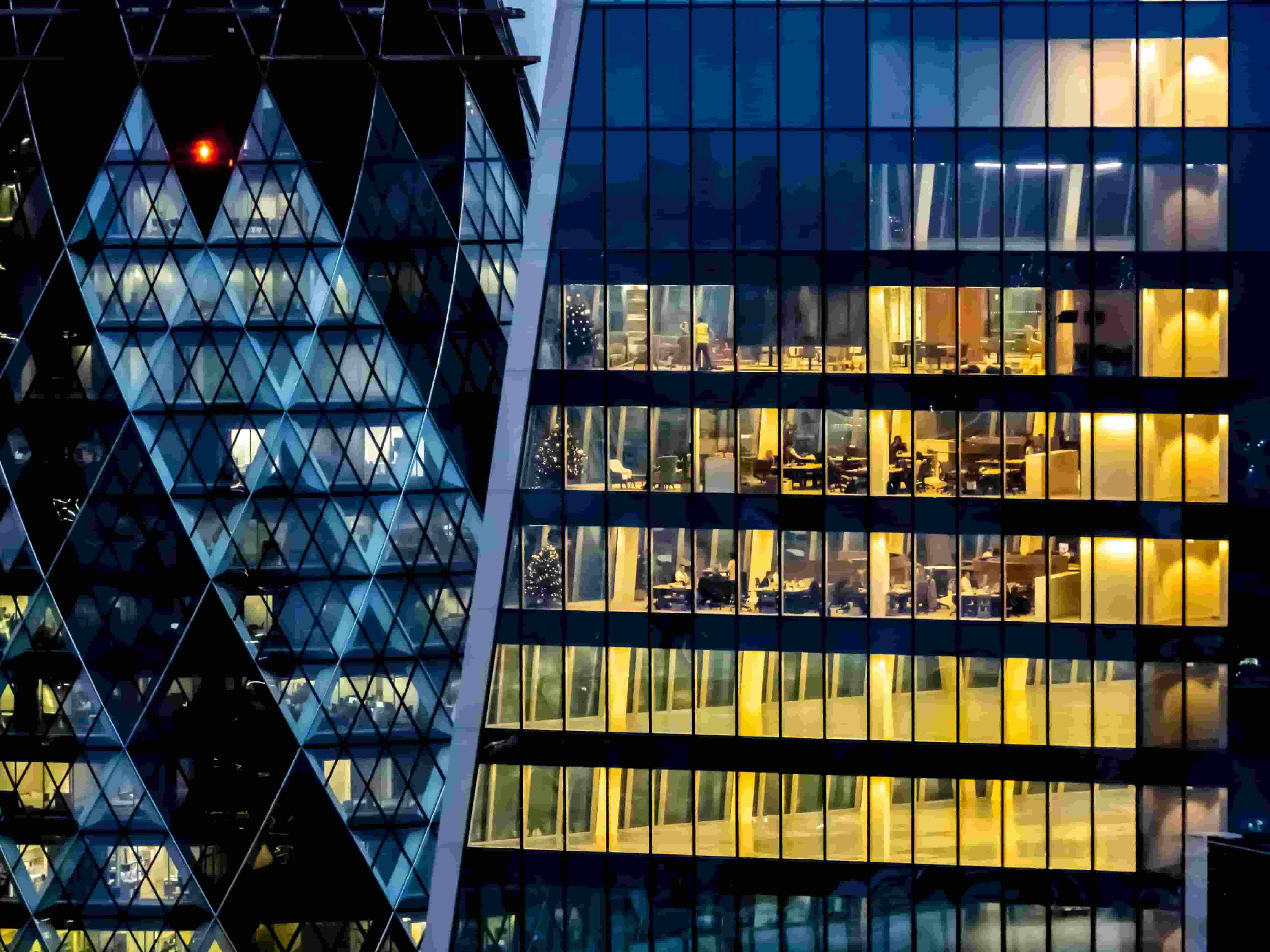 Lighted offices in a large tower with officespace